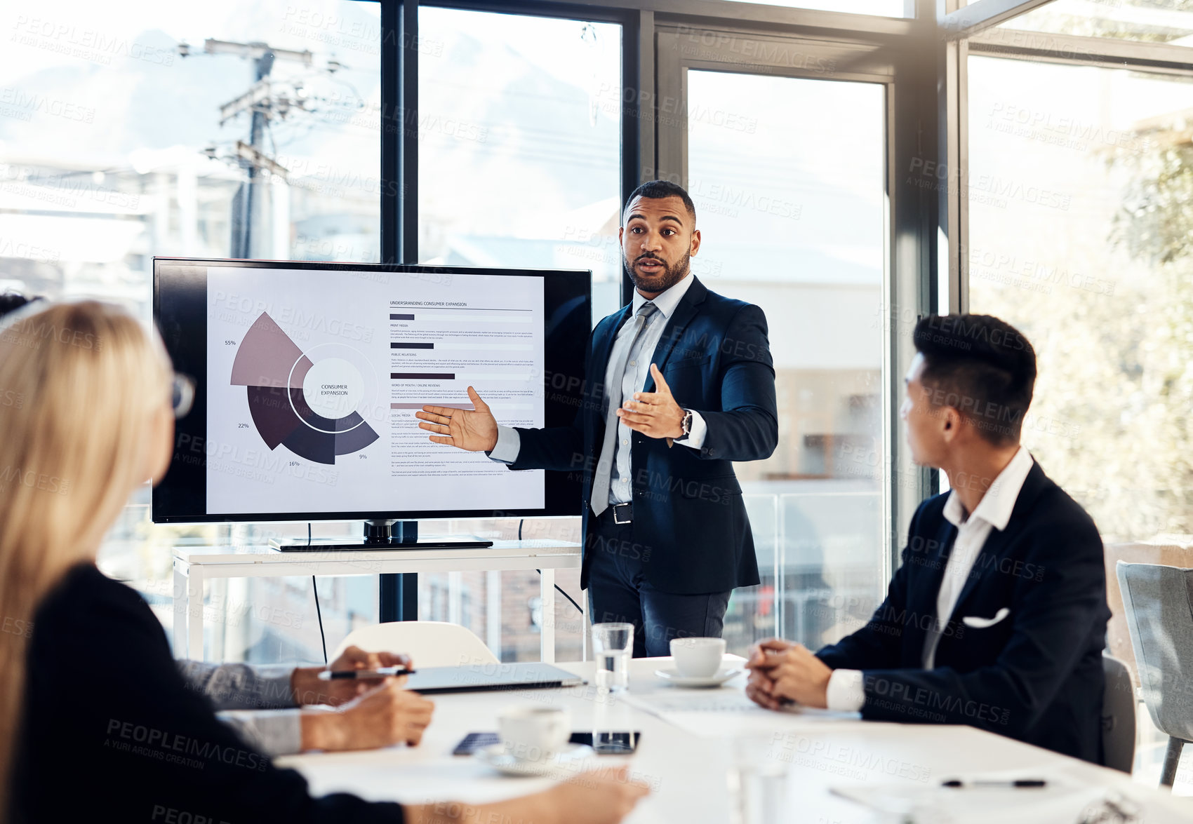 Buy stock photo Workshop, meeting and finance with a business man talking to his team in the office boardroom. Training, presentation and education with a male coach teaching staff using a graph display at work