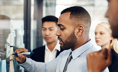 Buy stock photo Shot of a group of young businesspeople having a brainstorming session together in a modern office