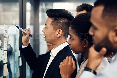 Buy stock photo Teamwork, window and writing with business people in workshop at office for upskill development. Conversation, glass and meeting with employee group in corporate workplace for strategy or vision