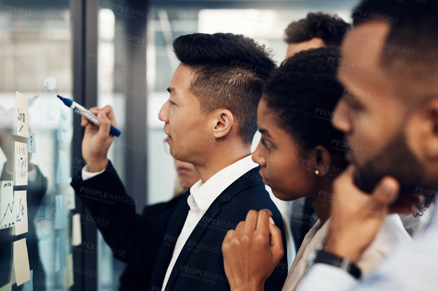 Buy stock photo Teamwork, window and writing with business people in workshop at office for upskill development. Conversation, glass and meeting with employee group in corporate workplace for strategy or vision