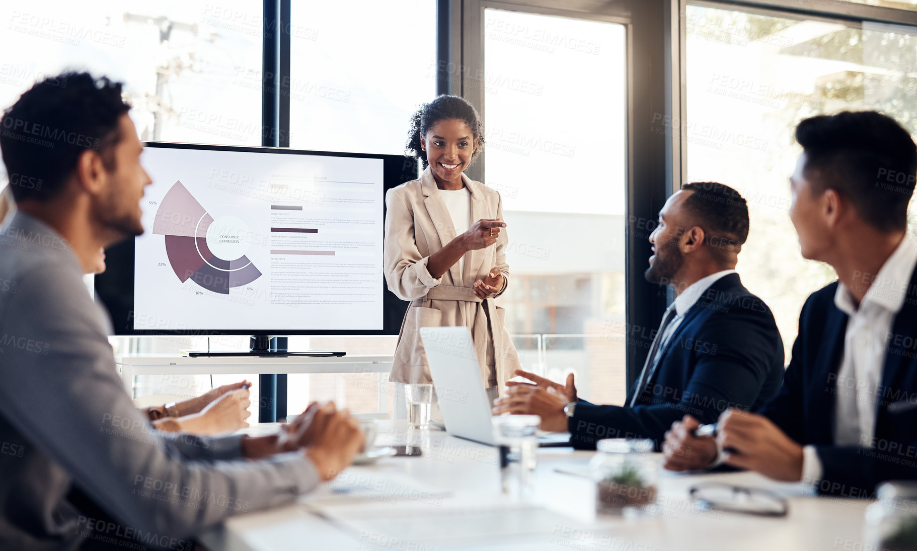 Buy stock photo Presentation, meeting and finance with a business woman talking to her team in the office boardroom. Training, workshop and education with a female coach teaching staff using a graph display at work