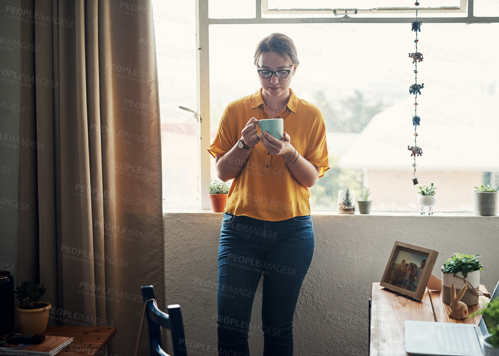 Buy stock photo Coffee, thinking and morning with woman at window for daily affirmation, relax and inspiration. Idea, vision and calm with female person and drinking tea at home for cozy, nostalgia and memory 