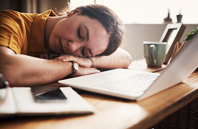 Buy stock photo Cropped shot of an attractive young businesswoman sitting and sleeping in her home office during the day