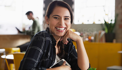 Buy stock photo Portrait of an attractive young woman sitting in a cafe