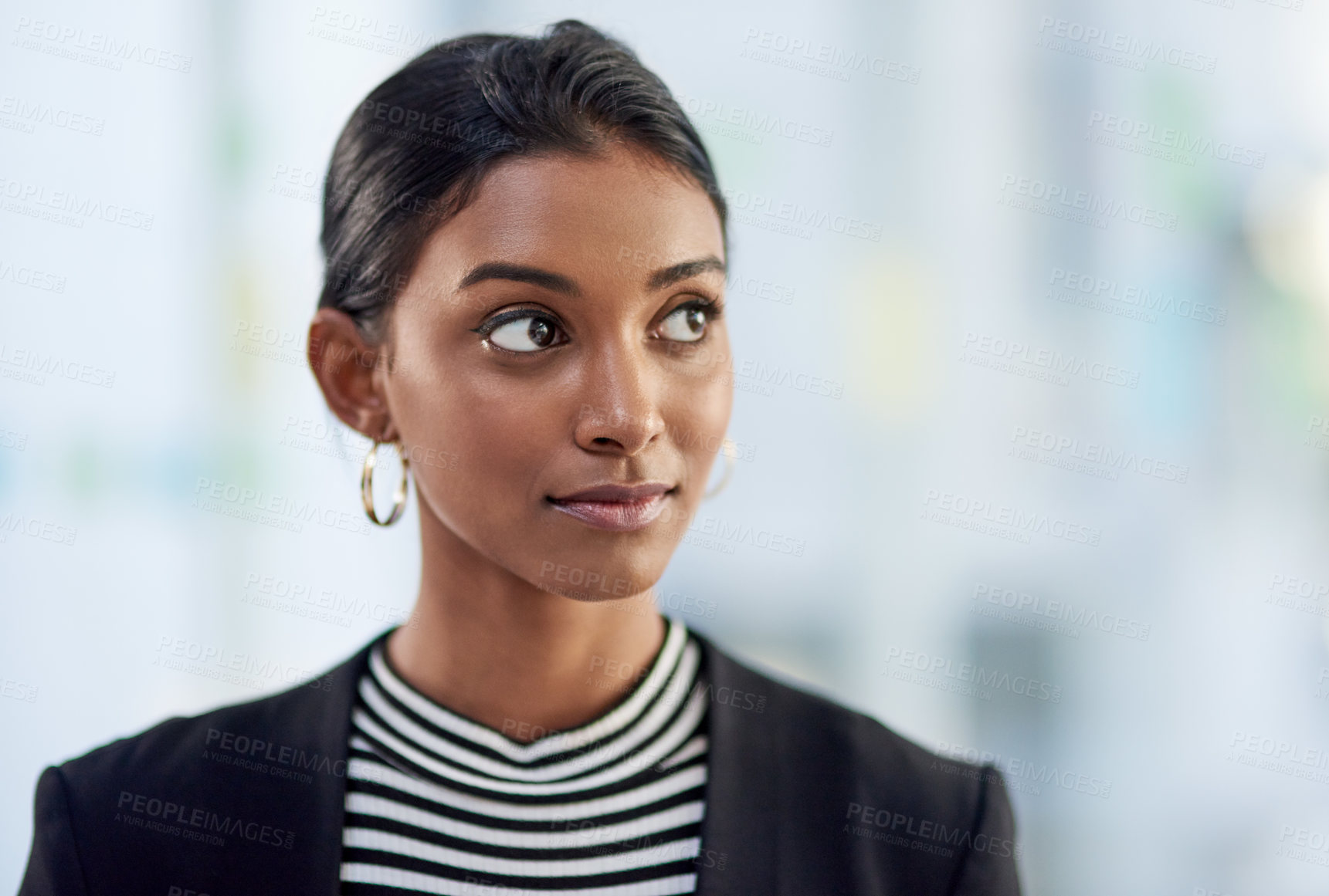 Buy stock photo Shot of an attractive young businesswoman looking thoughtful and confident  inside her office at work