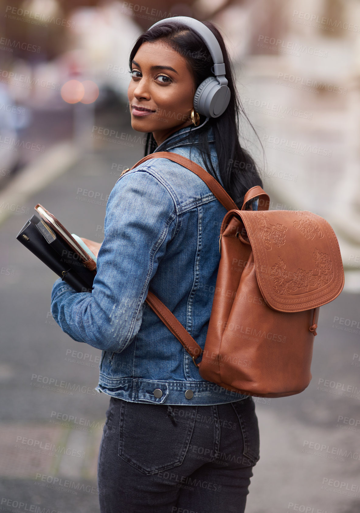 Buy stock photo City, backpack and portrait of student with headphones for travel, education and music on commute to campus. College, Indian girl and book with technology for learning, audio streaming and journey