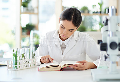 Buy stock photo Woman, scientist and reading with notebook in lab for study of plants for botany or ecology with biotechnology. Female specialist or doctor, research and medical results of experiment or test.