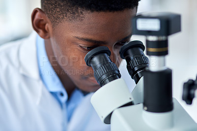 Buy stock photo Science, research and black man with microscope for engineering, investigation or medical analysis in laboratory. Biotech, lab technician or scientist checking vaccine sample for pharmaceutical test.