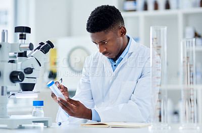 Buy stock photo Science, laboratory and black man with test tube for medical analysis, research and microscope. Healthcare, biotechnology and scientist with sample container for experiment, medicine and development