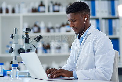 Buy stock photo Science, man and laptop in lab with research for medical study, microscopic experiment or DNA testing with earphones. Scientist, african expert and happy for gene editing and healthcare breakthrough