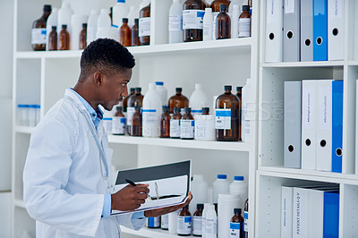 Buy stock photo Black man, scientist and folder for stock in laboratory inventory for logistics, update and products. Doctor writing, pharmacist, clipboard or bottles with chemical supply or checklist for research