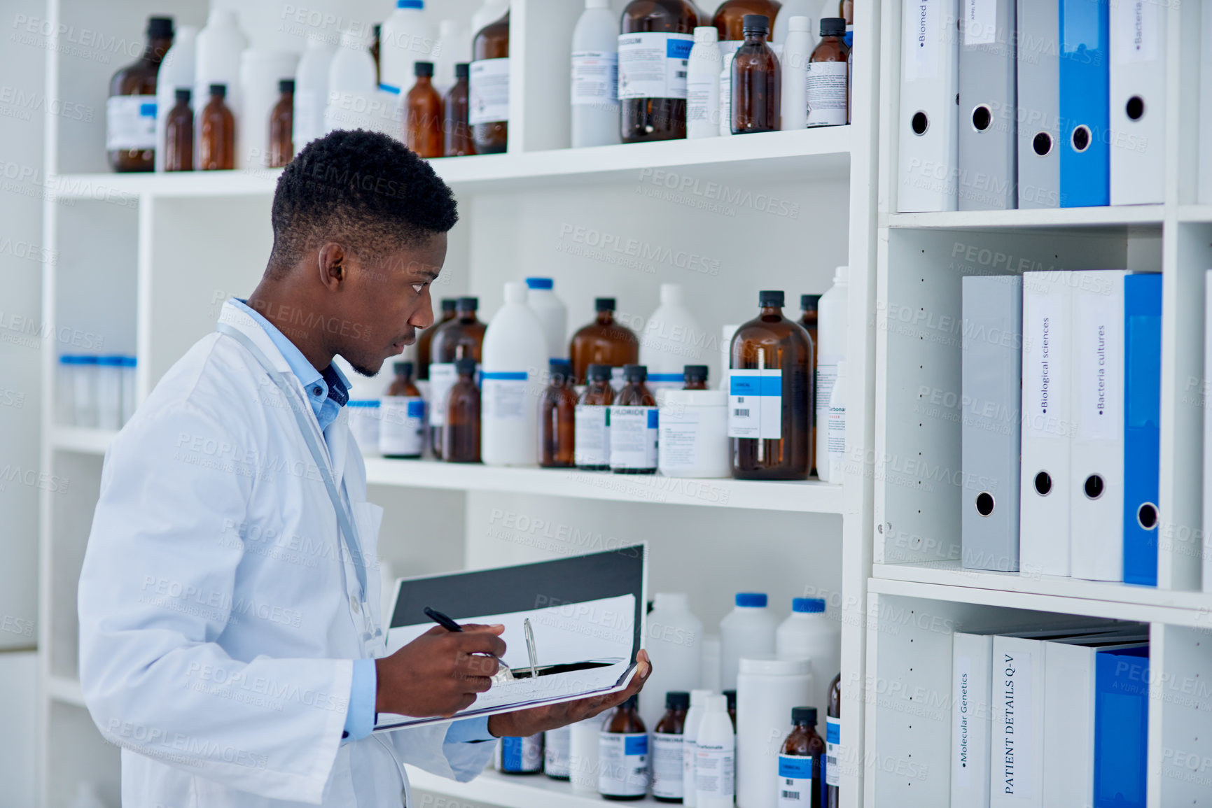 Buy stock photo Black man, scientist and folder for stock in laboratory inventory for logistics, update and products. Doctor writing, pharmacist, clipboard or bottles with chemical supply or checklist for research