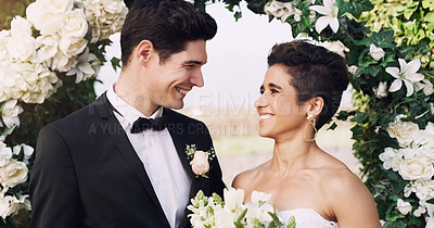 Buy stock photo Couple, wedding and love at celebration with smile, ceremony and bouquet at venue. Bride, groom and happiness at marriage for commitment, promise and excited for union, trust and flower arch