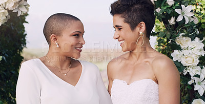 Buy stock photo Love, marriage and lgbtq with lesbian couple at wedding for celebration, gay and pride. Smile, spring and happiness with women at ceremony event for partner commitment, queer relationship and freedom