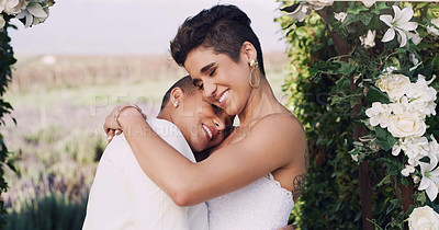 Buy stock photo Love, hug and lgbtq with lesbian couple at wedding for celebration, gay and pride. Smile, spring and happiness with women at marriage event for partner commitment, sexuality and freedom