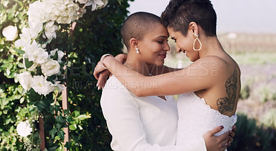 Buy stock photo love, hug and kiss with lesbian couple at wedding for celebration, gay and pride. Smile, spring and happiness with women at marriage event in garden for partner commitment, lgbtq and freedom