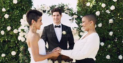 Buy stock photo Love, holding hands and happy with lesbian couple at wedding for celebration, gay and pride. Smile, spring and happiness with women at marriage event for partner commitment, sexuality and freedom
