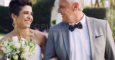 Buy stock photo Cropped shot of an affectionate mature father smiling at his daughter while walking her down the while on her wedding day