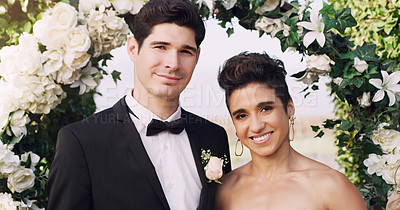 Buy stock photo Cropped portrait of an affectionate young newlywed couple smiling while standing together on their wedding day
