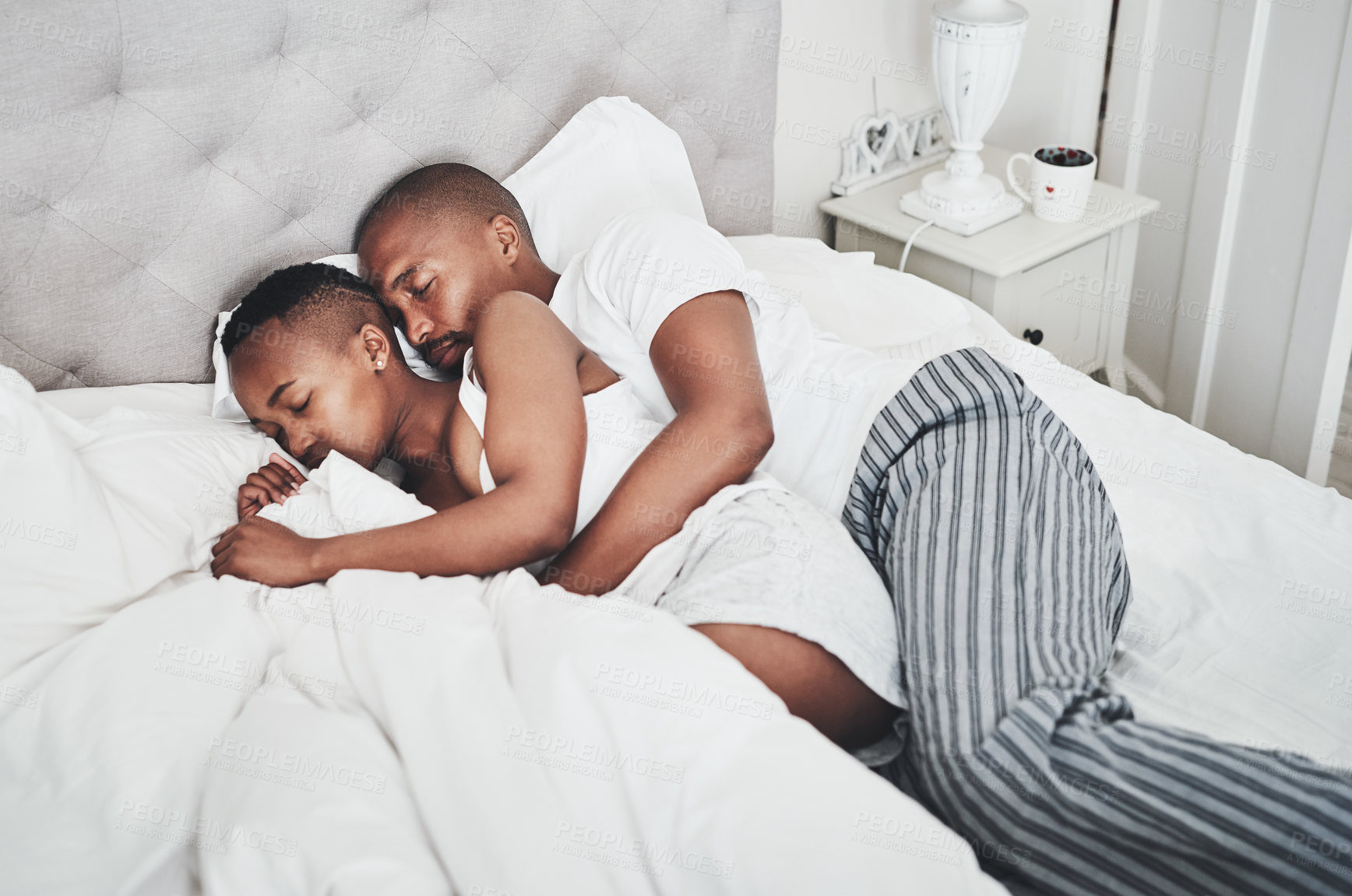 Buy stock photo Home, nap and black couple in bed sleeping together with love and care in a house. Tired black woman, morning and sleep of a African man and girlfriend in a house feeling lazy and relax on weekend