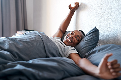 Buy stock photo Wake up, happy and black man on bed in morning for relaxing, resting and sleeping in bedroom. Apartment, house and person with smile, blanket and comfortable for health, peace and calm for nap