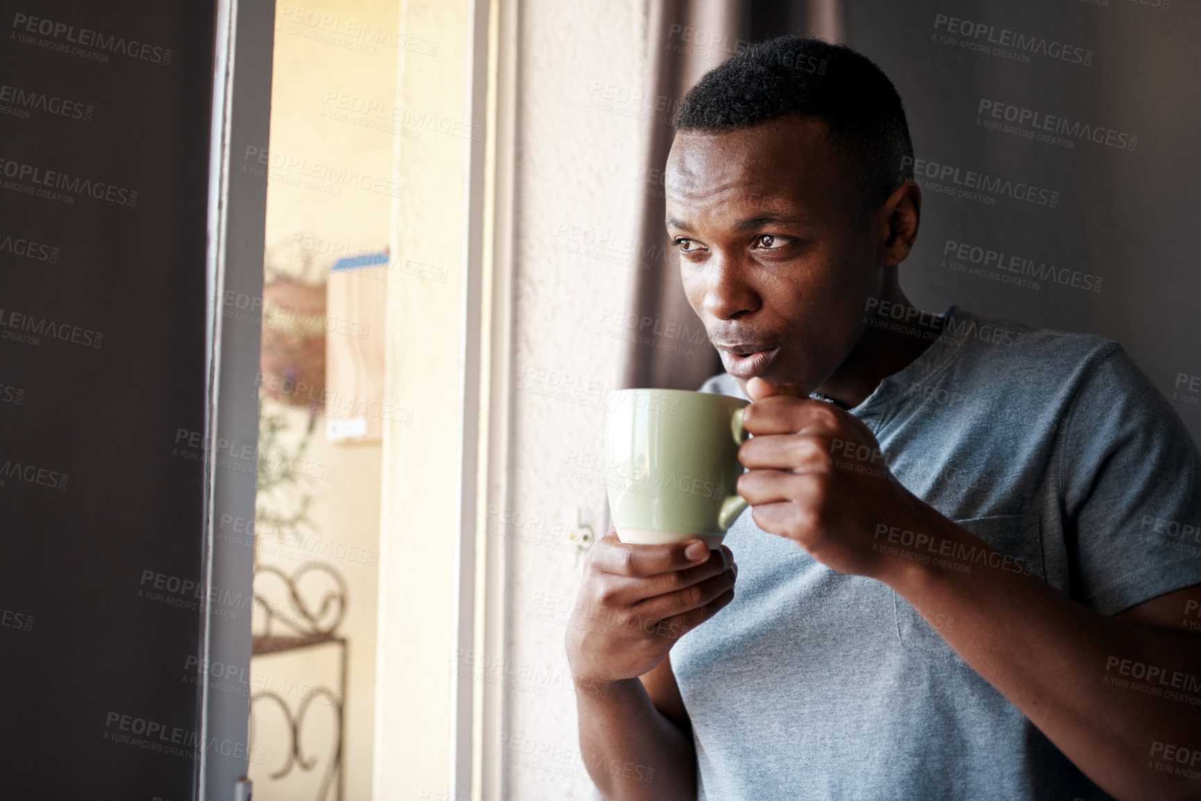 Buy stock photo Coffee, morning and black man in window in home with drink, caffeine beverage and cappuccino for aroma. Happy, thinking and person with mug in living room for breakfast, relaxing and wellness