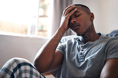 Buy stock photo Bedroom, tired or black man with stress for insomnia, depression or sad after break up at home. Male person, trauma or frustrated with headache for relationship crisis, anxiety or heartbreak in house