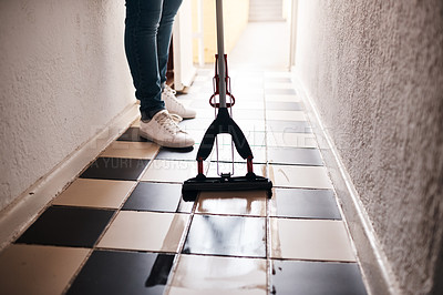 Buy stock photo Cropped shot of an unrecognizable man mopping the floor at home
