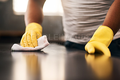 Buy stock photo Man hands, cleaning gloves and wipe on a table with a wash cloth and housekeeping. Home, countertop and male person with disinfectant and scrub with washing in a apartment with maid and housekeeper