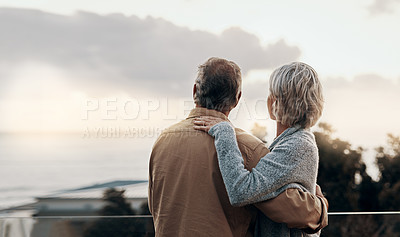 Buy stock photo Rearview shot of an unrecognizable mature couple embracing each other while celebrating a new year outdoors