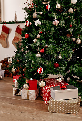 Buy stock photo Christmas, tree and gift on the floor of a home living room in celebration or preparation for the festive season. Morning, present and tradition with a Christmas tree in a house for xmas holidays