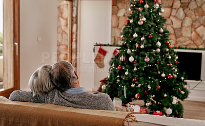 Buy stock photo Senior couple, christmas and hug from back view relax on sofa in living room with christmas tree. Love, support and festive holiday celebration or senior man and woman relax on couch together at home