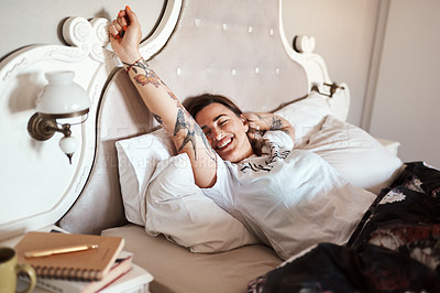 Buy stock photo Cropped shot of a happy young woman waking up from her sleep