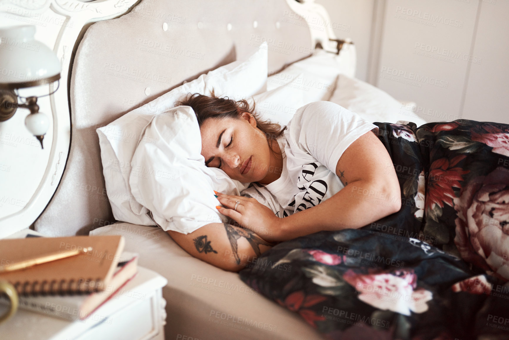 Buy stock photo Cropped shot of a beautiful young woman sleeping in her bed