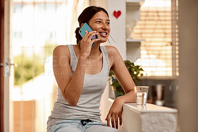 Buy stock photo Shot of a young woman using a smartphone in the morning at home