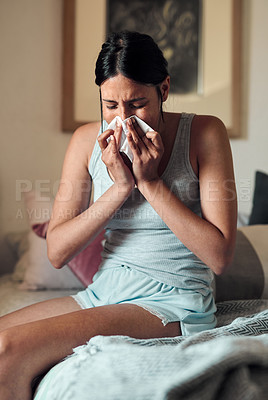 Buy stock photo Young, woman and blowing with nose in bedroom for health,  virus or infection in spring. Female person, sick and toilet paper in home with cough or allergy, mucus with congestion and headache
