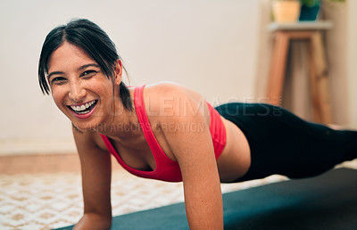 Buy stock photo Portrait of a happy young woman exercising at home