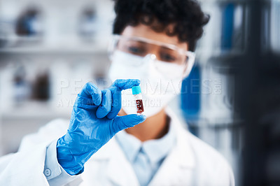 Buy stock photo Closeup shot of a young scientist working with samples in a lab