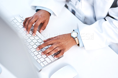 Buy stock photo High angle shot of an unrecognisable scientist working on a computer in a lab