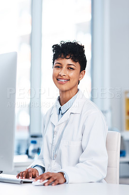 Buy stock photo Portrait of a young scientist working on a computer in a lab