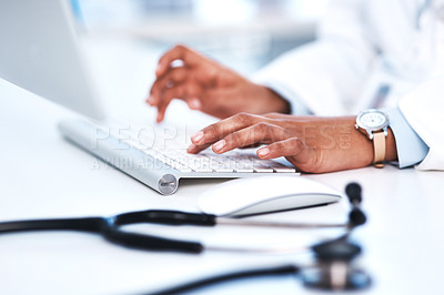 Buy stock photo Closeup shot of an unrecognisable doctor working on a computer in a lab