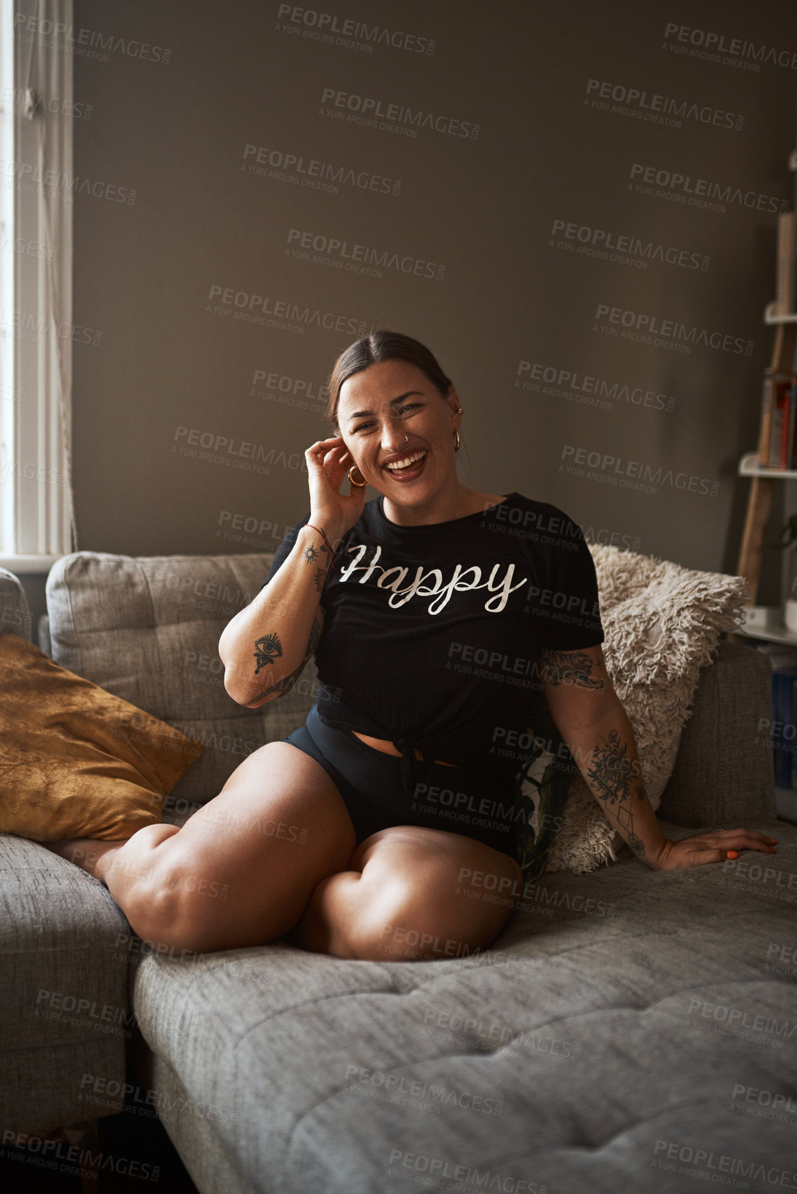 Buy stock photo Woman, happy and portrait on sofa for relax, confidence and body positivity in home. Girl, smile and underwear on living room couch with comfort space, wellness or tattoos for aesthetic or self care