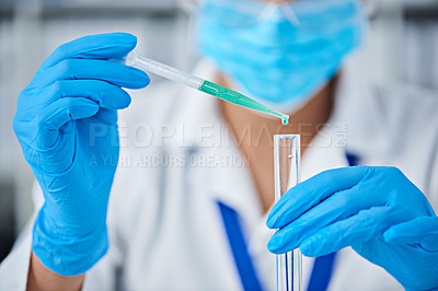 Buy stock photo Cropped shot of a scientist conducting an experiment in a laboratory