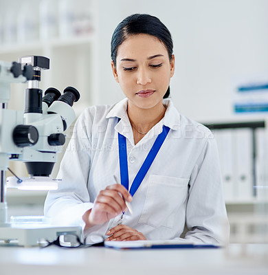 Buy stock photo Woman, notebook and microscope for research in laboratory for medical, development and clinic analysis. Female scientist, technology and innovation for medicine, chemistry and paperwork in hospital