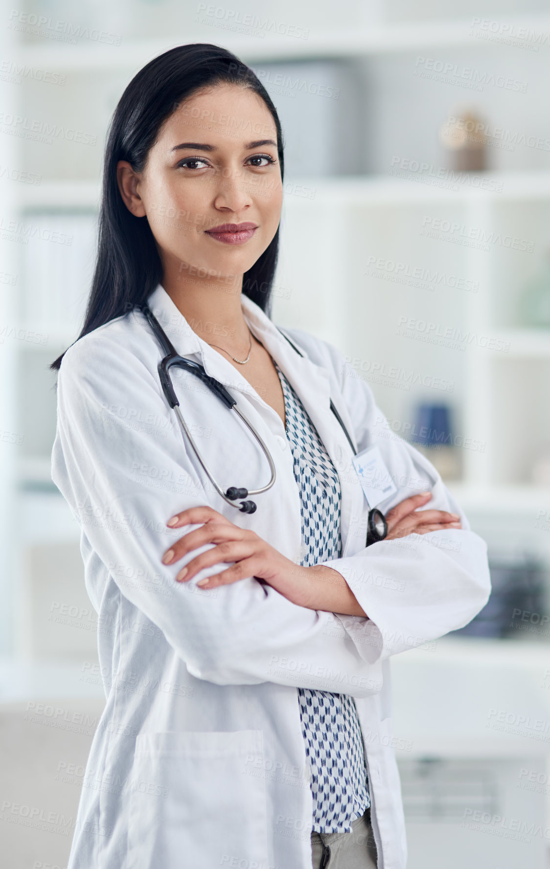 Buy stock photo Portrait of a confident young doctor working in a clinic