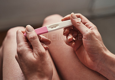 Buy stock photo Pregnancy test, hands and woman with pregnant results in her home, apartment or house with positive result. Planning, baby and person or mother with maternity testing stick for fertility confirmation