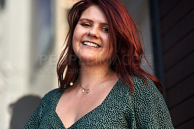 Buy stock photo Cropped shot of a beautiful young woman posing outdoors