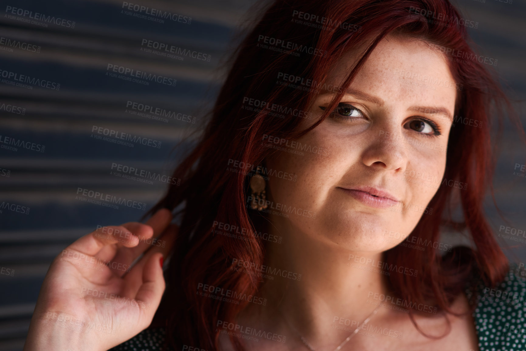 Buy stock photo Woman, portrait and smile at wall with confidence, skincare and natural beauty in Ireland. Female person, happy and positive attitude by garage door with red hair, style or satisfaction for hairstyle