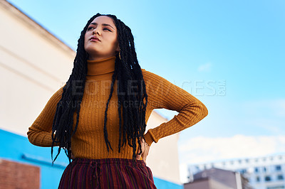 Buy stock photo Cropped shot of a beautiful young woman out in the city during the day