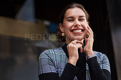 Buy stock photo Cropped shot of a beautiful young woman out in the city